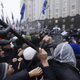 Opposition protesters clash with police in front of the Ukrainian Cabinet of Ministers in Kiev on Nov. 25.